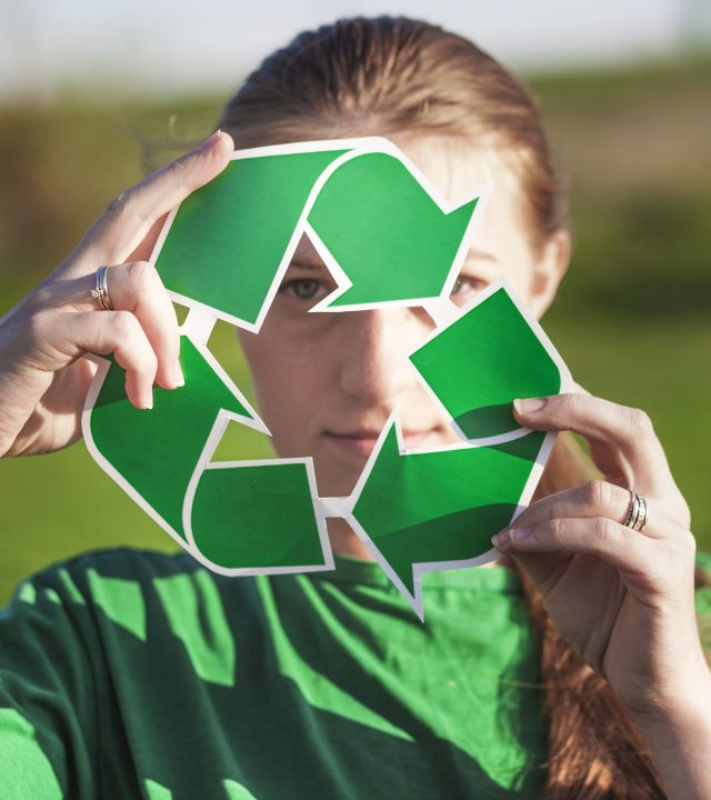 recycle-background-with-woman-holding-recycle-sign